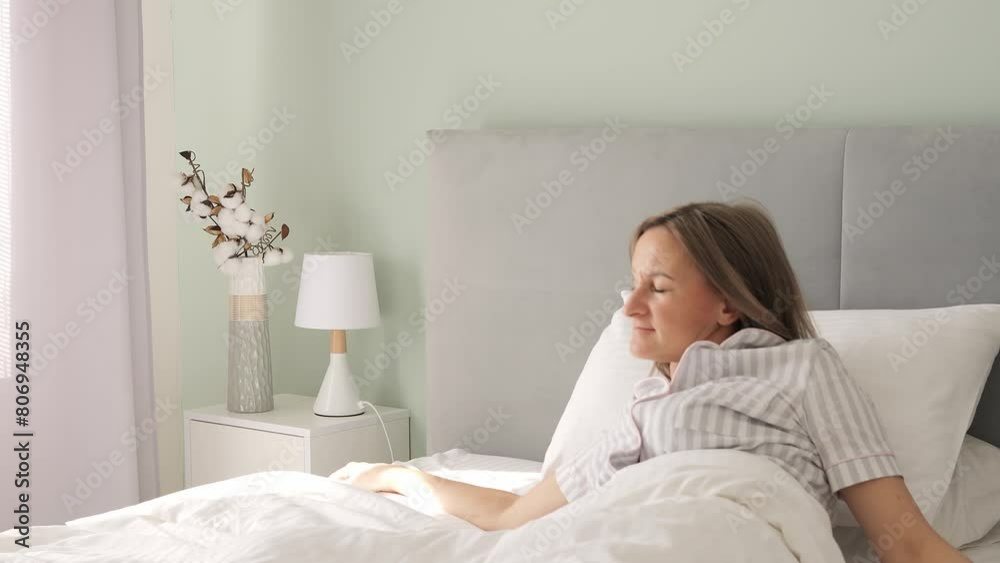 A woman stretches on her bed, welcoming the morning. The calm of the morning envelopes her as she gradually awakens. Another peaceful morning arrives, greeting the day with a gentle stretch. A woman stretches on her bed, welcoming the morning. The calm of the morning envelopes her as she gradually awakens. Another peaceful morning arrives, greeting the day with a gentle stretch.