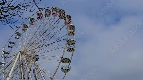 Ferris wheel at day time in summer with blue sky  photo