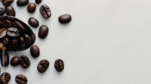 A spoon with coffee beans, white studio environment.