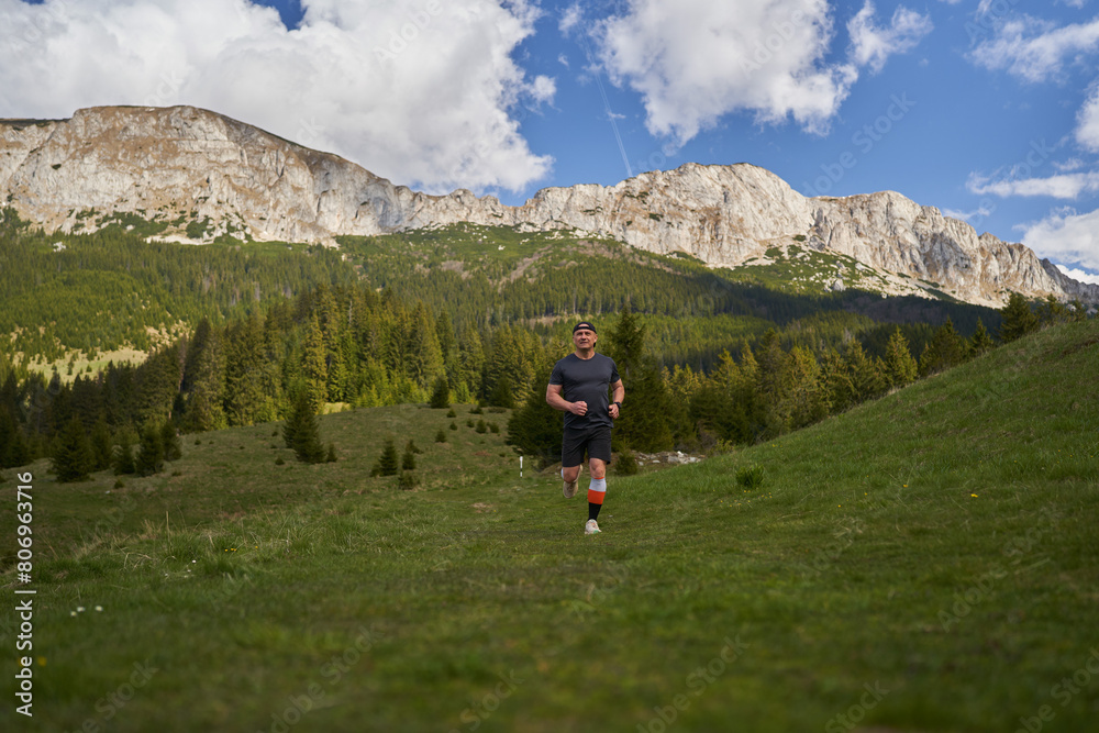 Mature trail runner in the mountains Mature trail runner in the mountains