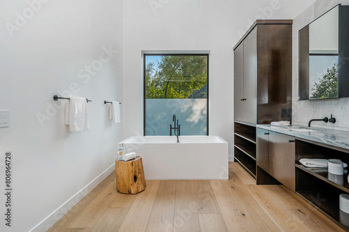 a bathroom with a wooden stool  sink and mirror  along with the tub area