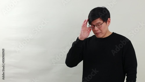 Handsame man talking - Portrait Asian man with dioptrical glasses talking on white background studio photo