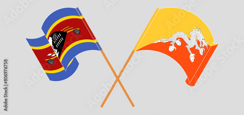 Crossed and waving flags of Eswatini and Bhutan