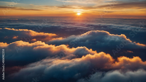 Envision a celestial spectacle, an abstract illustration of a sunset above the clouds, stretching across an extra-wide format, evoking feelings of hope and the divine in a heavenly panorama. photo