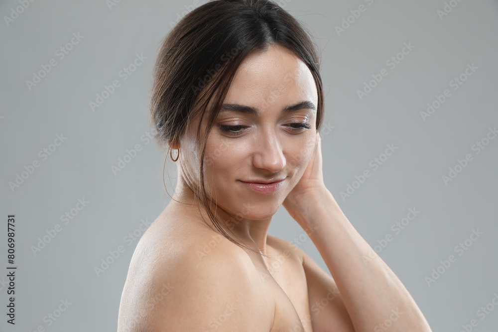 Portrait of beautiful woman on grey background Portrait of beautiful woman on grey background