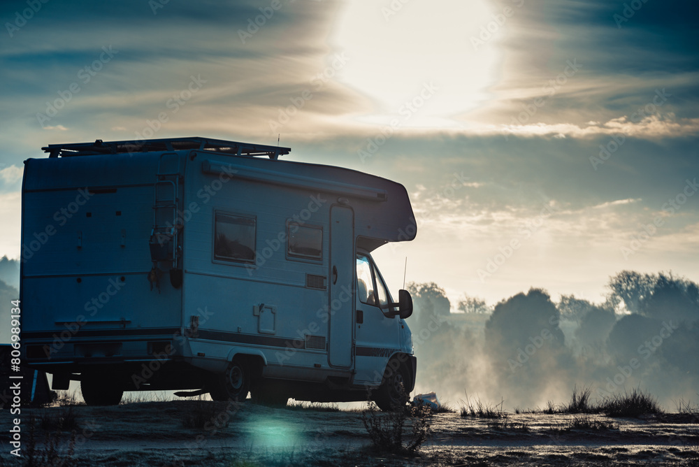 Rv caravan on lake shore. Autumn time, foggy morning Rv caravan on lake shore. Autumn time, foggy morning