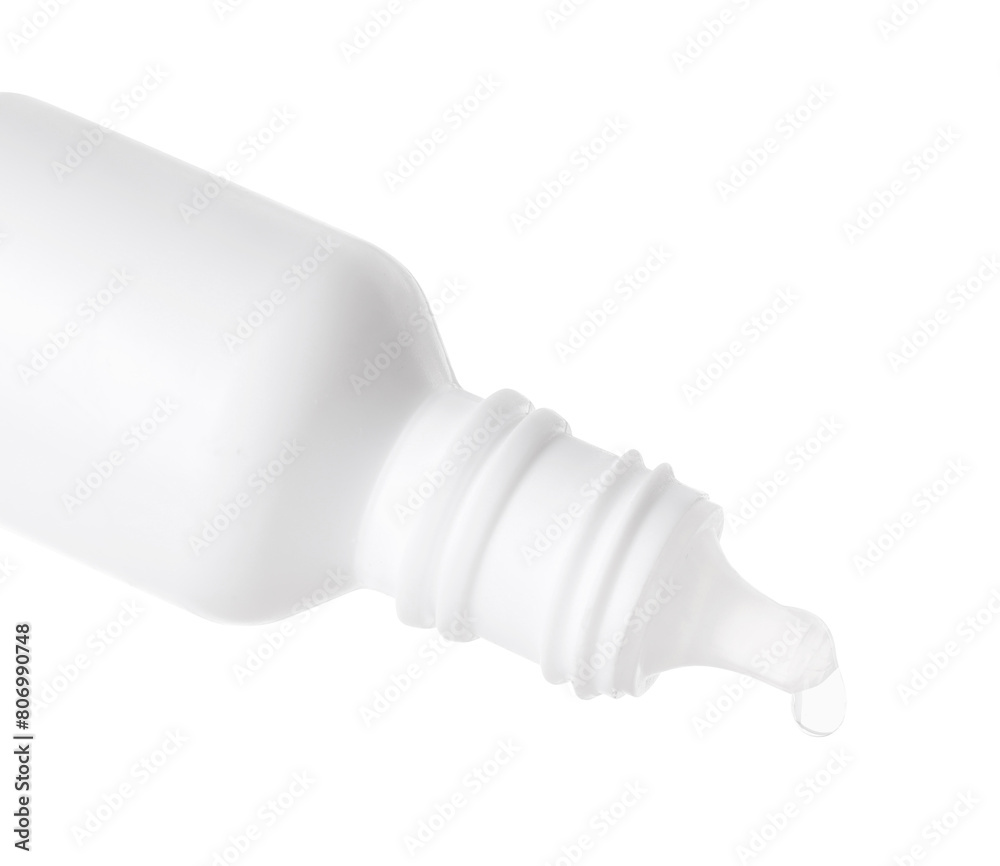 Dripping medical drops from bottle on white background