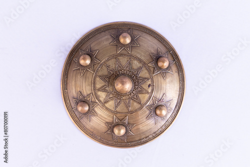 An ancient round shield used by soldiers in war