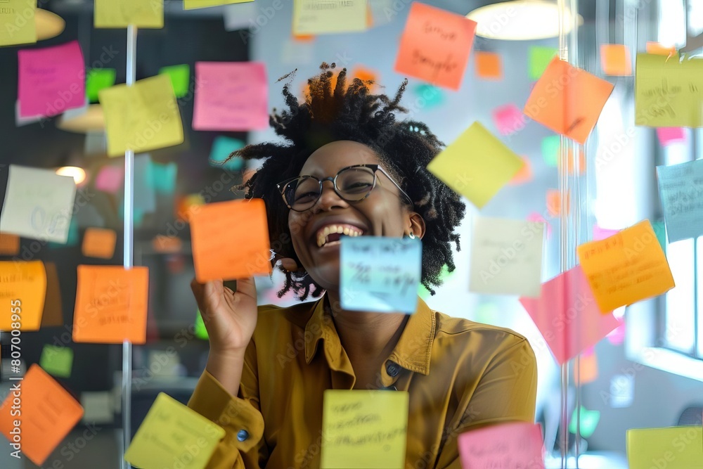 Carefree moments of multiracial laughter and joyful discovery amid an office freeforall of notes, markers and transparency, Carefree moments of multiracial laughter and joyful discovery amid an office freeforall of notes, markers and transparency,