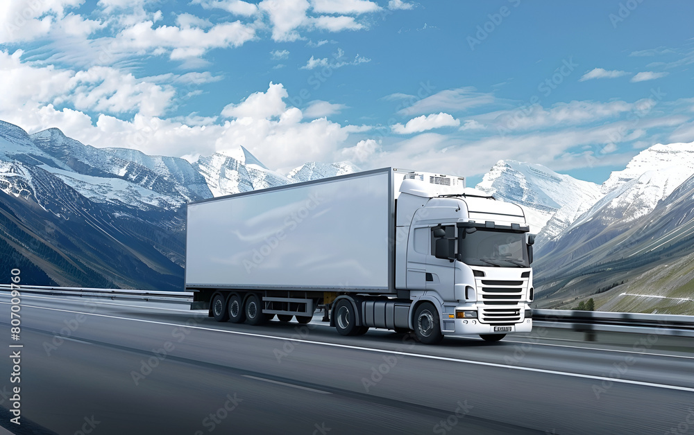 a white cargo truck with a white blank empty trailer for ad on a highway road in the united states. beautiful nature mountains and sky.