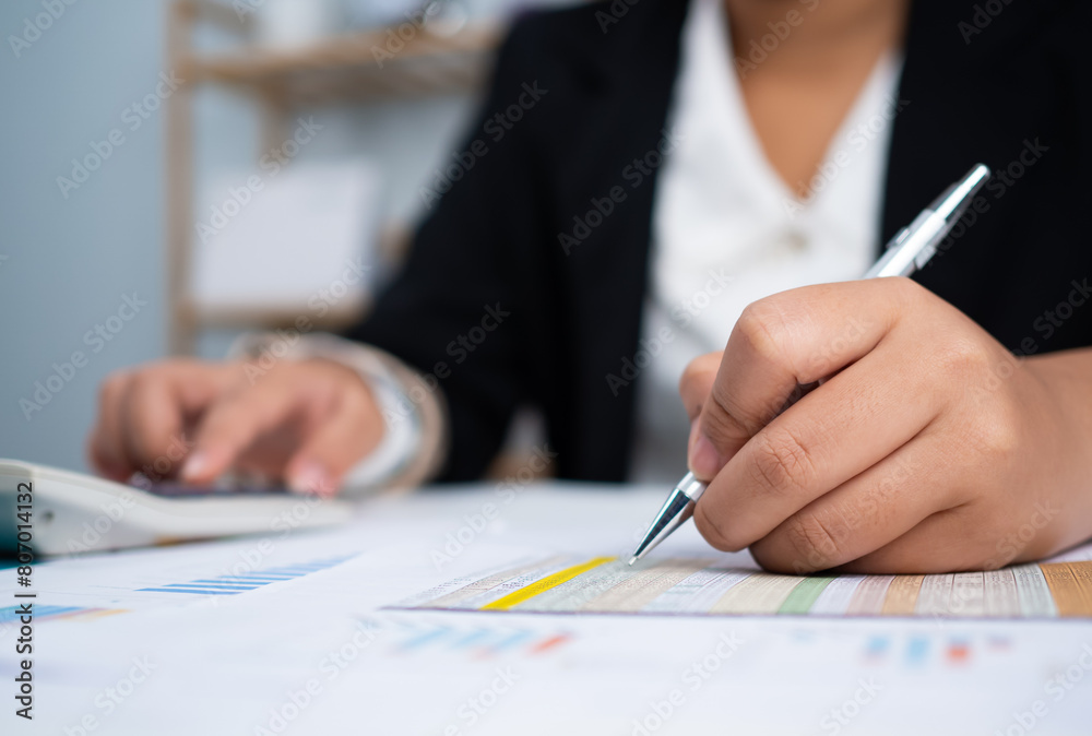 Business woman people use computers and paper documents to analyze business and manage corporate information. Business analysis with charts, indicators, and KPIs to improve organizational performance. Business woman people use computers and paper documents to analyze business and manage corporate information. Business analysis with charts, indicators, and KPIs to improve organizational performance.