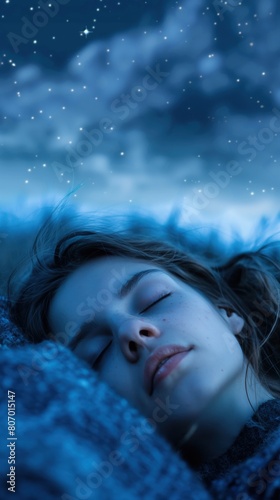 A woman peacefully sleeping on a blanket under the night sky