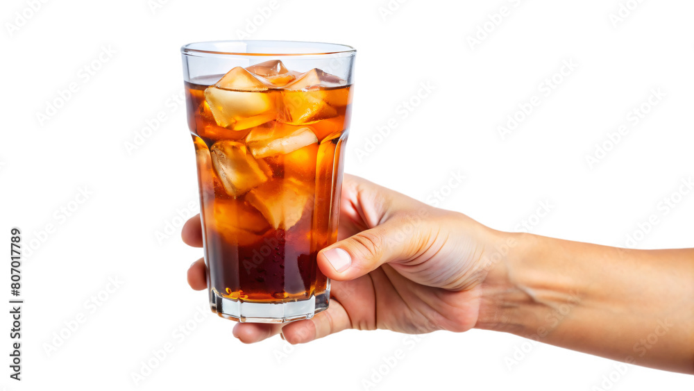 A hand holding a glass of iced tea A hand holding a glass of iced tea