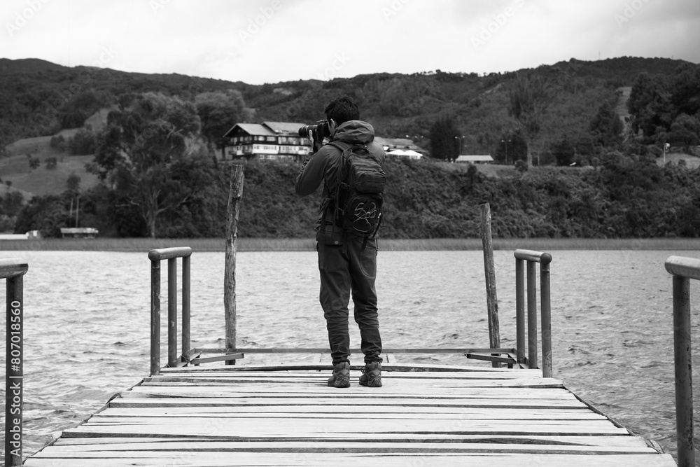 Black and white photographer at La Cocha lagoon