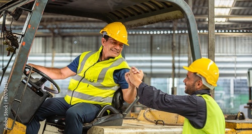 greeting by handshake touch fist and elbow of two engineer supervisor partnership in old factory. foreman greeting friend for good friendship colleague laborer in teamwork factory. photo