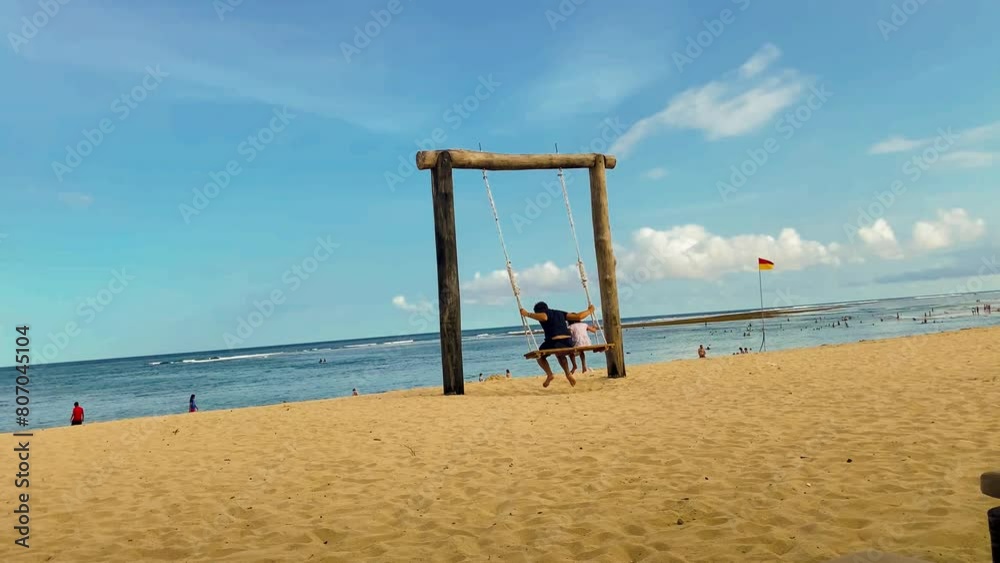 Swing and pathways at beach against blue sky Swing and pathways at beach against blue sky
