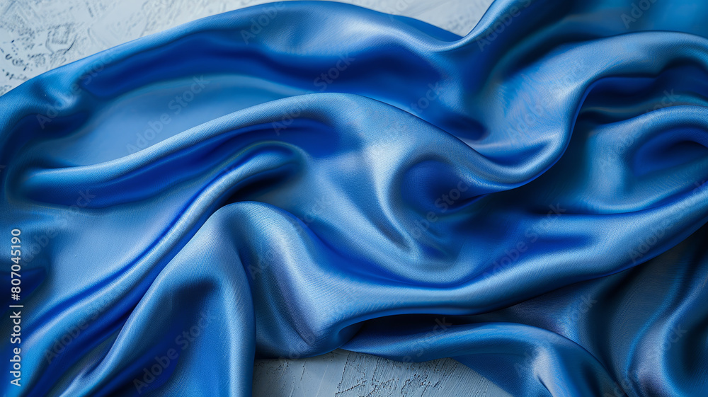 Obraz premium Satin blue fabric with waves