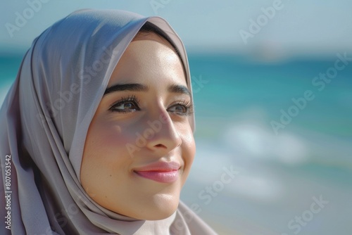 Arab Saudi woman poses on beach happy outdoors portrait.