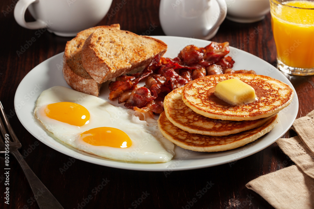 traditional full american breakfast eggs pancakes with bacon and toast
