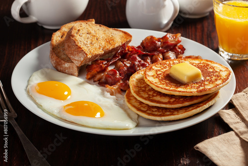 Obraz na płótnie traditional full american breakfast eggs pancakes with bacon and toast w salonie