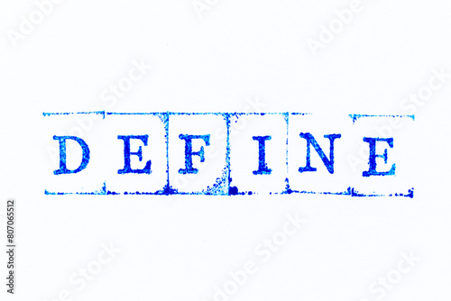 Tableau sur toile Blue color ink rubber stamp in word define on white paper background