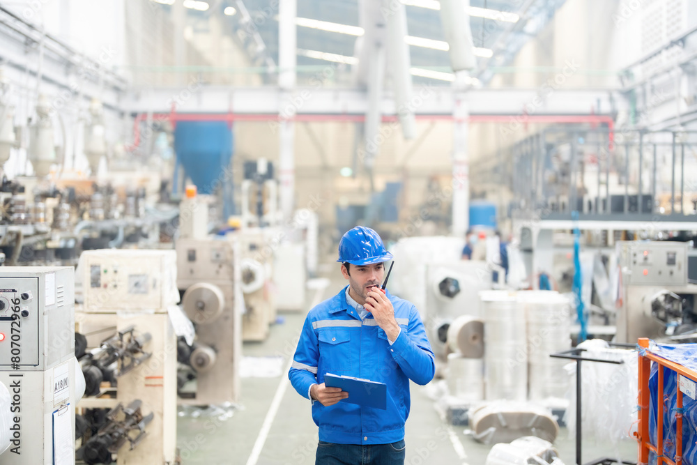 The European male engineer plays a pivotal role in managing industrial machinery within the plastic and steel factory, driving excellence in global market penetration.
