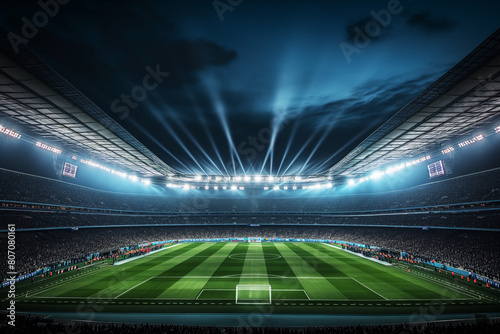 A soccer field with a large crowd of people watching the game