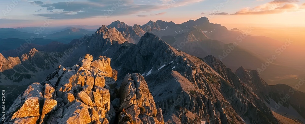 Fototapeta premium panoramic view of mountains at sunrise, rocky peaks, sharp rocks, mountain