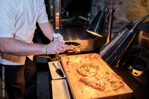 Chef preparing pizza on wood  photo