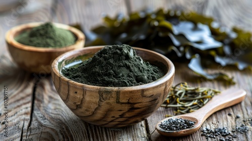 Kelp seaweed and spirulina powder with konbu and seaweed on wooden background