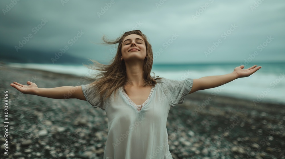 Woman in white dress open arms eyes closed enjoy sea breeze seaside rocky beach long hair Caucasian female Woman in white dress open arms eyes closed enjoy sea breeze seaside rocky beach long hair Caucasian female