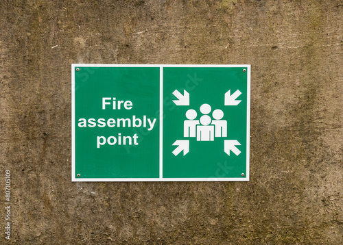 Fire assembly point sign on a wall