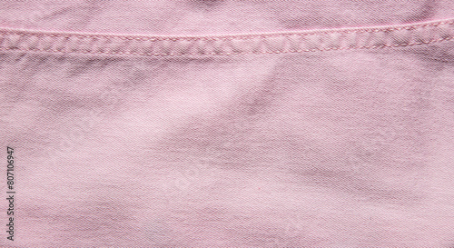 texture of pink jeans denim fabric with seam background