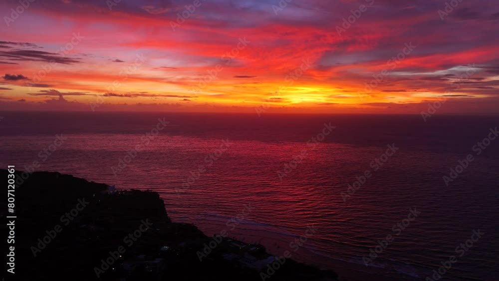 Aerial shot of sunset in Uluwatu beach. Uluwatu beach has the best sunsets in Bali. Aerial shot of sunset in Uluwatu beach. Uluwatu beach has the best sunsets in Bali.