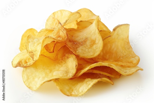 A pile of freshly fried potato chips glistening against a white background photo