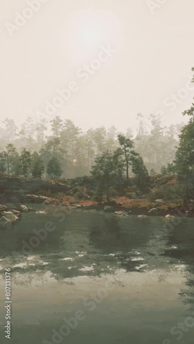 A Tranquil Scene of a Gold-Bearing River Surrounded by Trees and Rocks photo