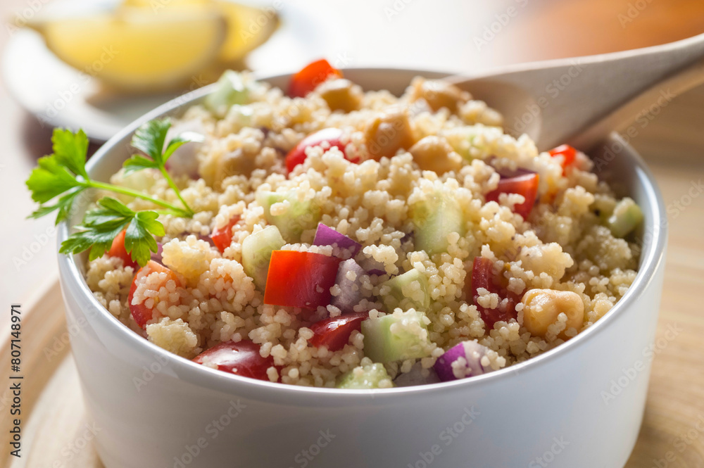 cold tabouleh of couscous in bowl and spoon cold tabouleh of couscous in bowl and spoon