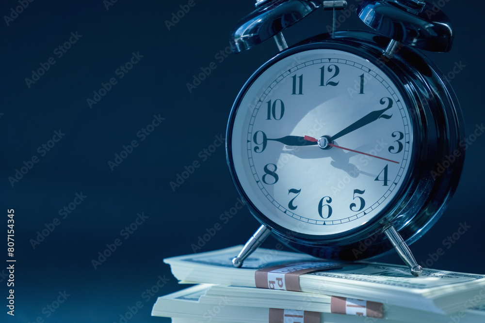Time is money. Business, investment, financial assets and liabilities, earnings, passive income concept. Close up clock with money. Copy space. Time is money. Business, investment, financial assets and liabilities, earnings, passive income concept. Close up clock with money. Copy space.