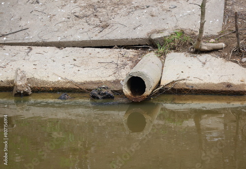 An old concrete sewer pipe on the canal bank