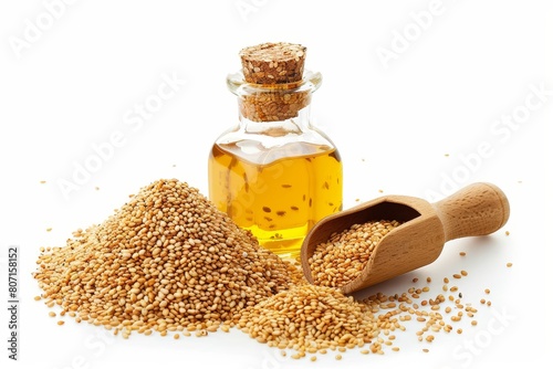 Sesame oil and spoon on white background photo