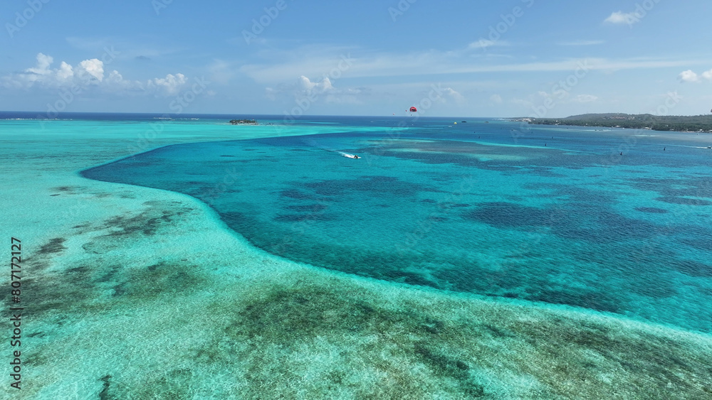 Blue Bay Water At San Andres In Caribbean Island Colombia. Colombian Caribbean Beach. Blue Sea Background. San Andres At Caribbean Island Colombia. Tourism Landscape. Nature Seascape.