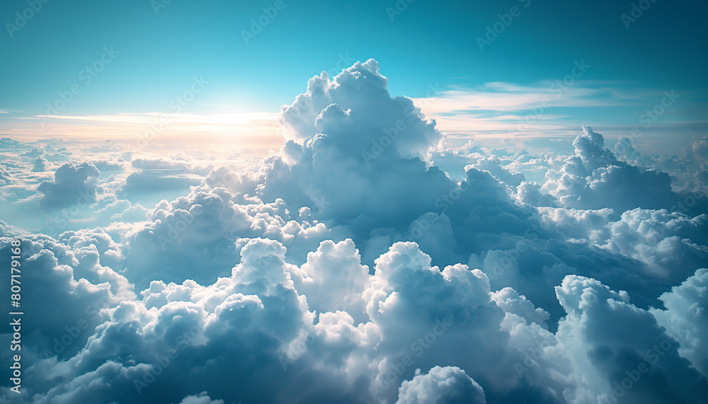Naklejka premium Beautiful above clouds cloudscape with a majestic wide angle horizon view during aircraft flying journey. Beauty of surrounding environment and traveling concept.