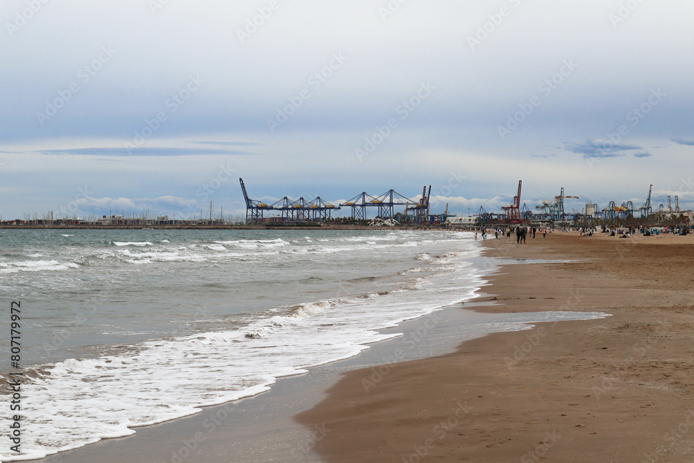 Mediterranean beach overlooking the cargo port.