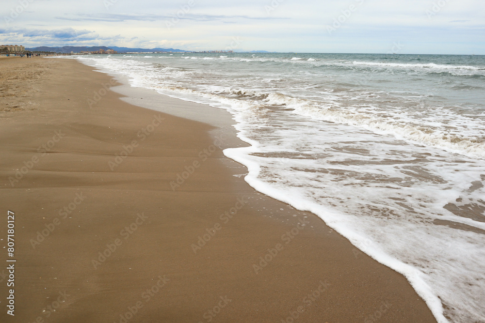 Mediterranean Sea. Beautiful clean sand and sea foam.