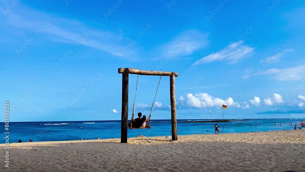 Swing and pathways at beach against blue sky Swing and pathways at beach against blue sky