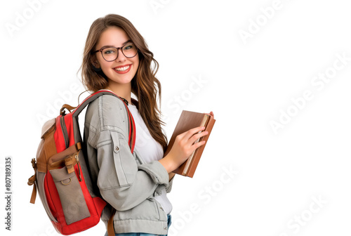 A woman student, wearing glasses and a backpack, holding a book.