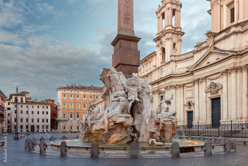 The famous fountains with tritons in Piazza Navona in Rome at dawn.