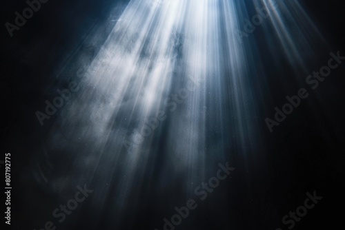 Sun rays isolated on black background for design overlay.