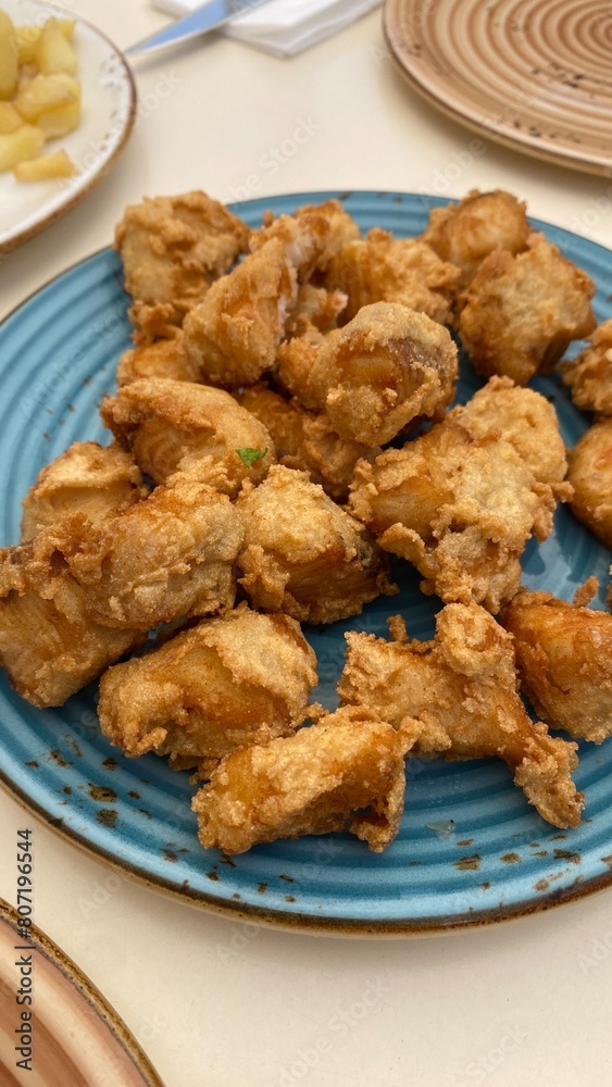A portion of dogfish in marinade. A typical tapa of Spanish cuisine.