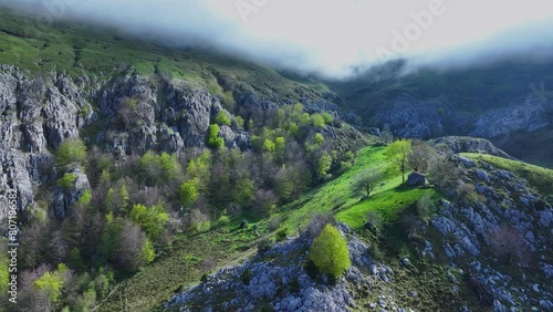 Cabins, meadows and beech forests in Los Machucos at 921 meters above sea level and communicates the villages of Bustablado and San Roque de Riomiera. Pasiegos Valleys, Cantabria, Spain, Europe photo